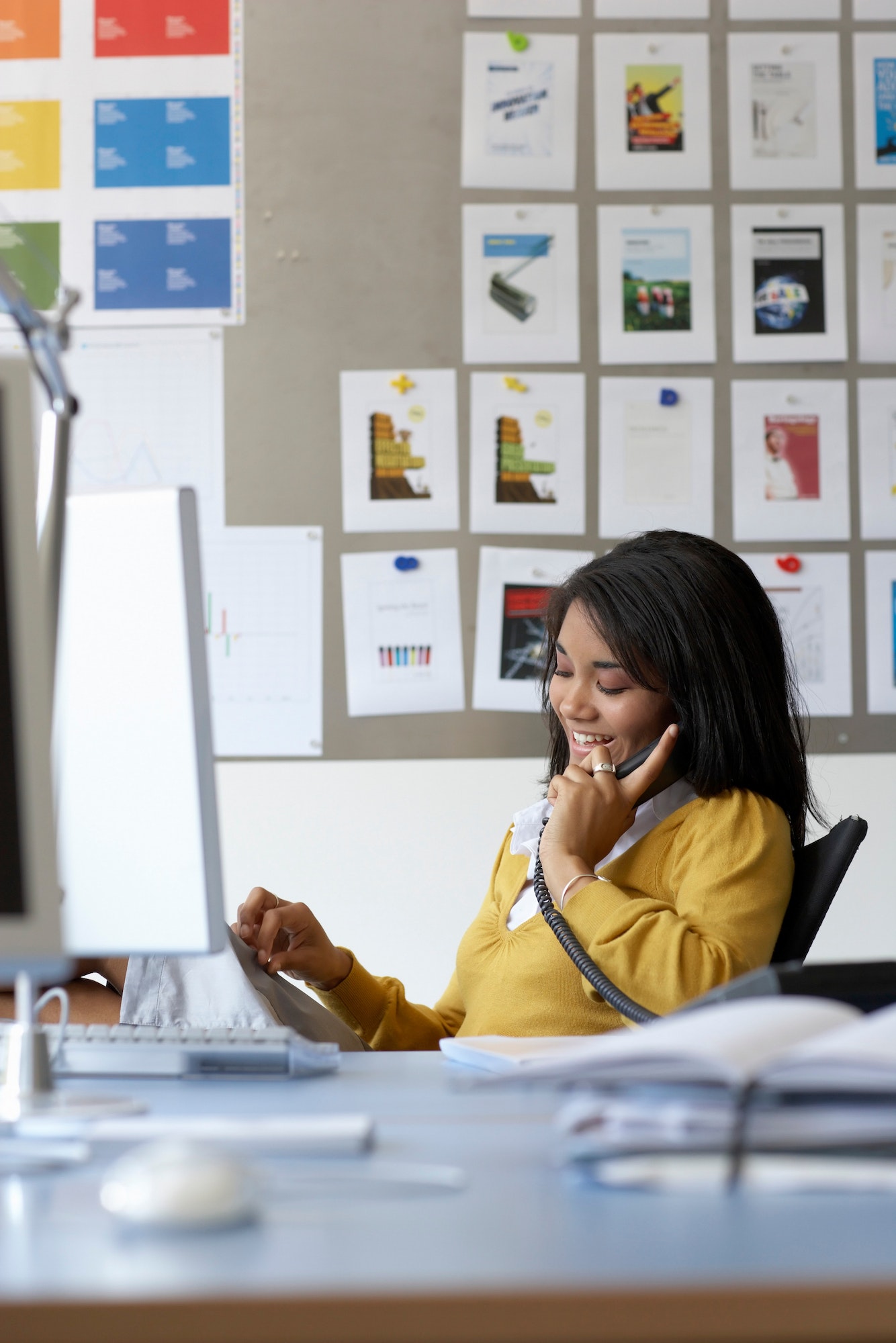 Businesswoman using telephone
